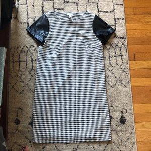 Black and white leather sleeved dress